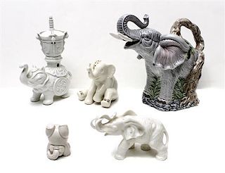 A Collection of Seven Porcelain Figures of Elephants, Height of largest 12 inches.