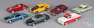 Twelve plastic built model cars