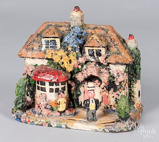 Folk art painted wood and composition cottage bank