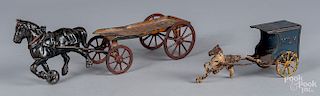 Two cast iron horse drawn wagons