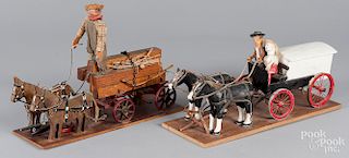 Two painted wood horse drawn wagons