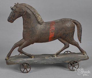 Early American tin running horse pull toy
