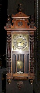 An Austrian Oak Wall Clock, Height 34 inches.
