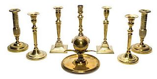 A Group of English Brass Candlesticks, Height of tallest 8 1/2 inches.