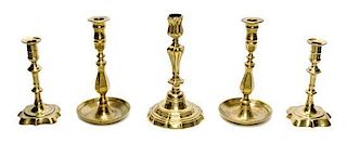 A Group of Five Continental Brass Candlesticks, Height of largest 9 inches.