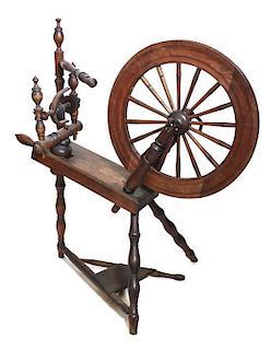 An American Walnut Spinning Wheel, Height 36 1/2 inches.