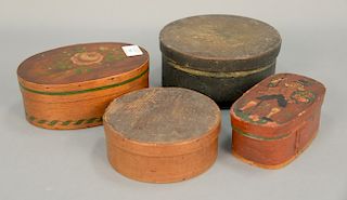 Four pantry boxes to include original green painted round box, natural wood round box, and two painted oval boxes, larger one marked...