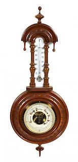 An American Wheel Barometer and Thermometer, Height 22 inches.