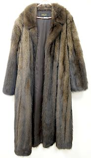 Two long woman's fur coats with silk liners one Lazare's Furs brown fur coat and a black fur coat with no tag