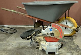 Delta compound mitre saw and wheelbarrow.