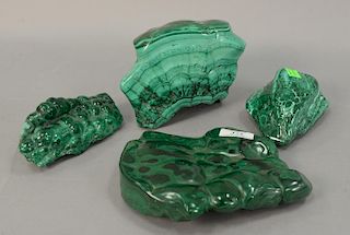 Group of four large malachite polished stone pieces. wd. 5in. to 8in.