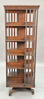 Danner mahogany revolving bookcase. ht. 67in., wd. 24in.