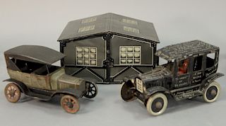Three tin toys including Marx wind up car Lizzy Ford Jalopy, Germany tin wind up car, and a double tin garage. garage: ht. 4 1/2in.,...