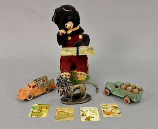 Two cast iron trucks including Hubley 2274 and beer truck with rubber tires Nursery Tales tin mechanical toy and a bronze lion figur...