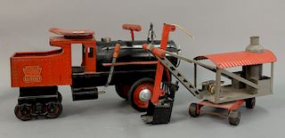 Two Keystone ride on pressed steel toys including Keystone 6400 R. R. railroad locomotive (lg. 26in.) and Ride Em steam shovel (lg....