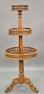 Three tier gallery table. ht. 68in.
