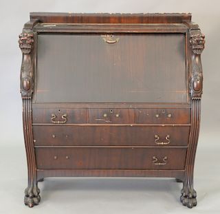 Mahogany desk with carved griffins. ht. 48in., wd. 44in.