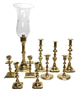 A Group of European Brass Candlesticks, Height of first 20 1/2 inches.