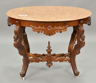Victorian oval marble top center table with light rouge marble on walnut base. ht. 29 1/2in., top: 23" x 36"