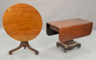 Two tables including an Empire drop leaf table and a large tip table (dia
