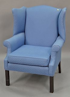 Custom upholstered wing chair.