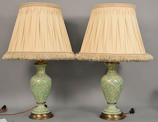 Group of ten lamps including eight table lamps, a pair of porcelain, lucite lamp, etc, along with a leather and brass floor lamp. 14...