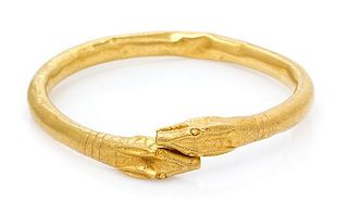 A Possibly Ancient High Karat Gold Animal Head Motif Armband, 32.30 dwts.