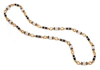 * A Yellow Gold, Cultured South Sea Pearl, Diamond and Onyx Longchain Necklace, 131.00 dwts.