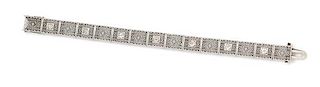 * An Art Deco Platinum Topped 14 Karat White Gold and Diamond Bracelet, 11.20 dwts.