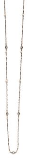 * A Platinum, Diamond and Seed Pearl Longchain Necklace, 4.70 dwts.