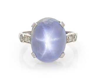 * An Art Deco Platinum, Star Sapphire and Diamond Ring, 4.70 dwts.