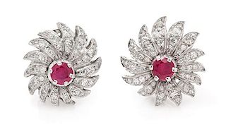 A Pair of Platinum, Ruby and Diamond Floral Motif Earclips, 7.00 dwts.