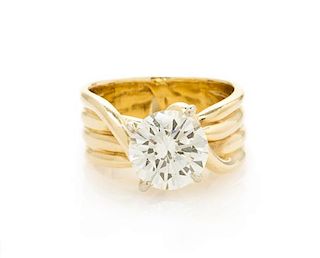 * A 14 Karat Yellow Gold and Diamond Solitaire Ring, 6.10 dwts.