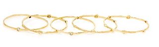 A Collection of 18 Karat Yellow Gold and Diamond Bangle Bracelets, 54.80 dwts.