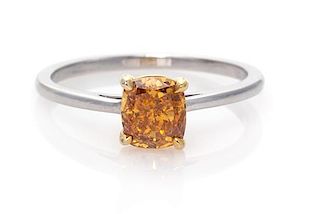A Platinum, Yellow Gold and Fancy Deep Yellowish Orange Diamond Solitaire Ring, 1.90 dwts.