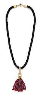 An 18 Karat Yellow Gold, Diamond and Ruby Bead Tassel Pendant and Silk Cord Necklace, Henry Dunay, 31.75 dwts.