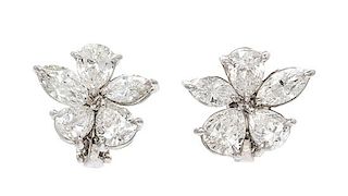 A Pair of Platinum and Diamond Floral Cluster Earclips, 5.10 dwts.