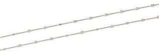 An 18 Karat White Gold and Diamond Station Necklace, 6.10 dwts.