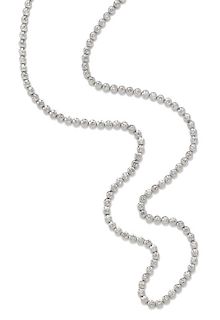 A 14 Karat White Gold and Diamond Longchain Riviere Necklace, 62.30 dwts.