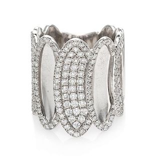 * An 18 Karat White Gold and Diamond Band Ring, House of Baguettes, 10.90 dwts.