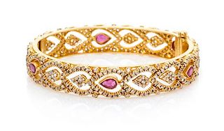A 22 Karat Yellow Gold, Ruby and Diamond Bangle Bracelet, 24.10 dwts.