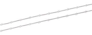 An 18 Karat White Gold and Diamond Station Necklace, 6.70 dwts.