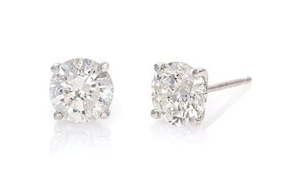 A Pair of 14 Karat White Gold and Diamond Stud Earrings, 0.90 dwts.