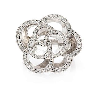 An 18 Karat White Gold and Diamond Floral Motif Ring, 12.15 dwts.