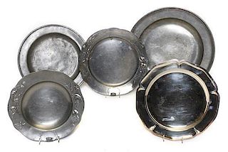 A Collection of Eight Pewter Chargers, Diameter of largest 16 inches.