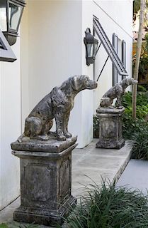 A Pair of Cast Stone Models of Dogs Height overall 51 inches.