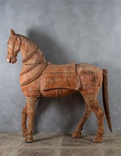 A Burmese Carved Wood Model of a Horse Height 77 x width 72 inches.