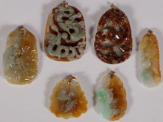 A GROUP OF SIX CHINESE CARVED JADE PENDANTS