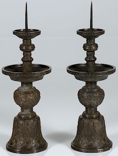 A PAIR OF CHINESE CAST BRONZE CANDLE STANDS