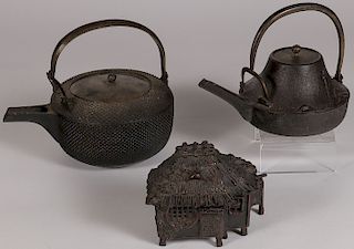 A PAIR OF JAPANESE CAST IRON TEAPOTS, 19TH C.